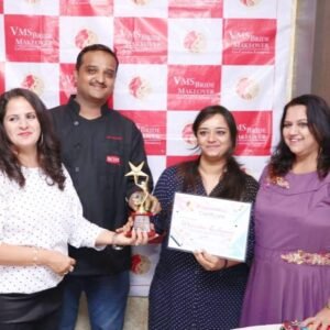 Morisha Alimchandani with award recognition and certificate